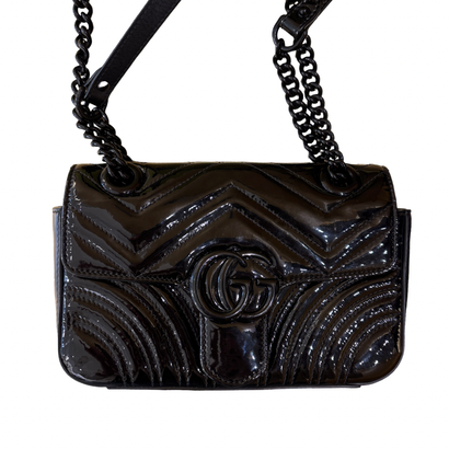 GUCCI “GG Marmont Flap” Bag in black leather,...