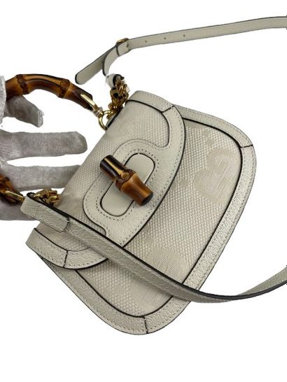 GUCCI “Vintage Convertible Bamboo Top Handle”...