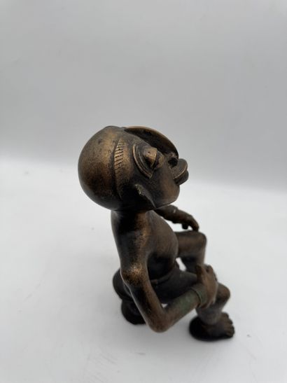 SEATED MALE STATUE WITH HANDS ON THIGHS
Mid-20th...