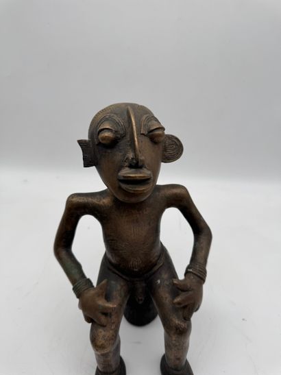 SEATED MALE STATUE WITH HANDS ON THIGHS
Mid-20th...