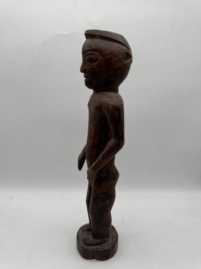 MALE STATUETTE
Mid-20th century. Wood with...