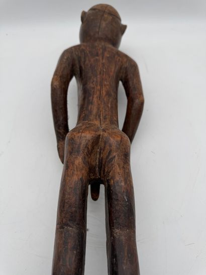 MALE STATUETTE
Mid-20th century. Wood with...
