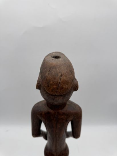 MALE STATUETTE
Mid-20th century. Wood with...