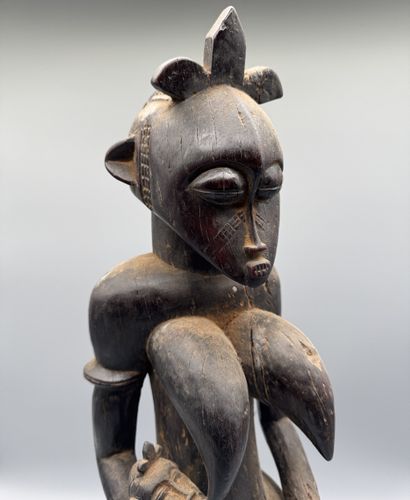 MOTHER WITH CHILD SEATED ON A STOOL, SENOUFO,...
