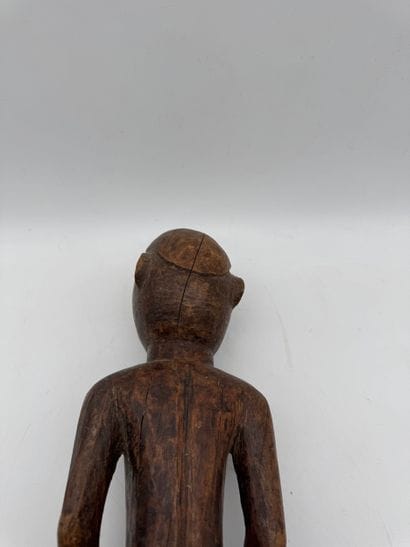 MALE STATUETTE
Mid-20th century. Wood with...