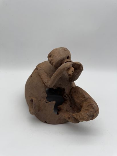 MASK WITH A FIGURE ON TOP
Mid-20th century....