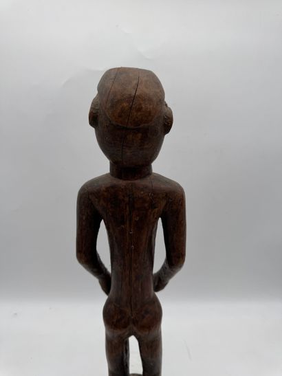 MALE STATUETTE
Mid-20th century. Wood with...