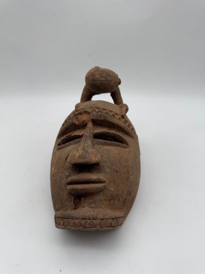 MASK WITH A FIGURE ON TOP
Mid-20th century....