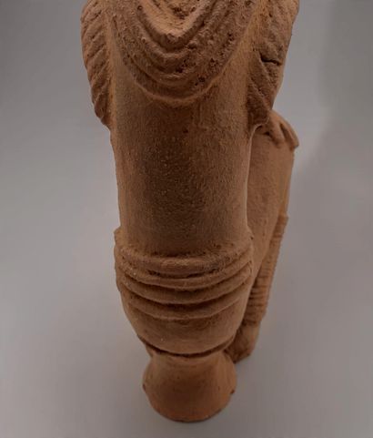 KNELT FIGURE, IN THE STYLE OF THE NOK CULTURE...