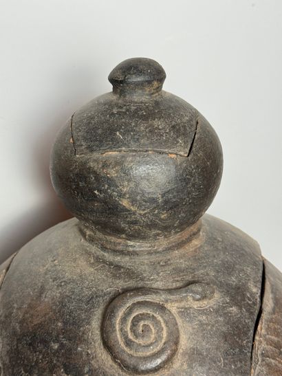 BILOBATE JAR WITH LID
Mid-20th century. Dark-colored...