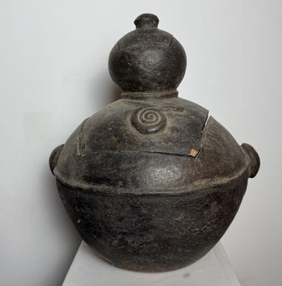 BILOBATE JAR WITH LID
Mid-20th century. Dark-colored...