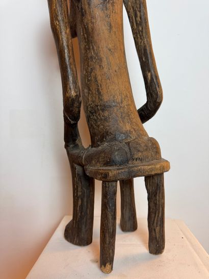 STATUE OF A SEATED WOMAN, SENOUFO, IVORY...