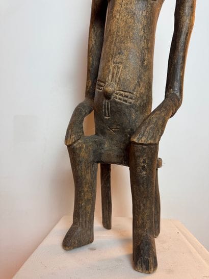 STATUE OF A SEATED WOMAN, SENOUFO, IVORY...