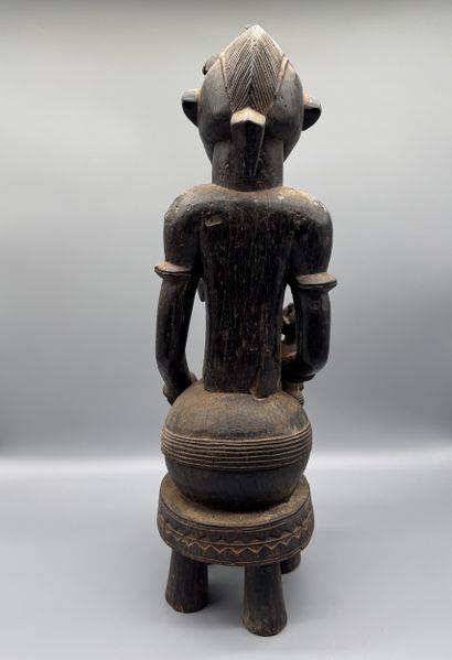 MOTHER WITH CHILD SEATED ON A STOOL, SENOUFO,...