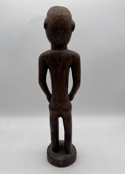 MALE STATUETTE
Mid-20th century. Wood with...