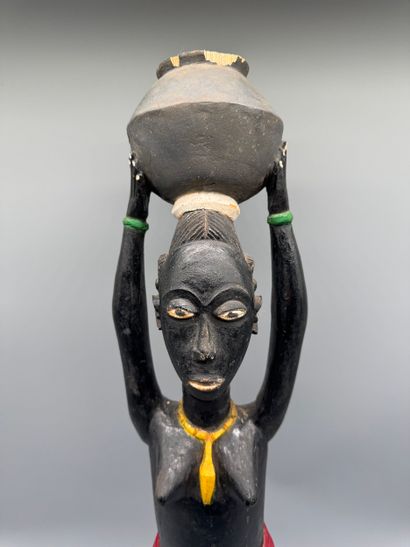 ANTHROPOMORPHIC STATUETTE DEPICTING A WOMAN...