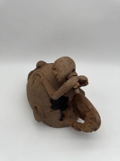 MASK WITH A FIGURE ON TOP
Mid-20th century....
