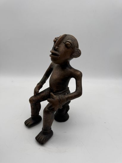 SEATED MALE STATUE WITH HANDS ON THIGHS
Mid-20th...