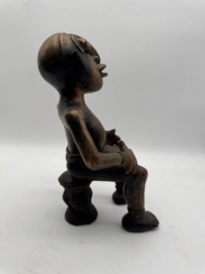 SEATED MALE STATUE WITH HANDS ON THIGHS
Mid-20th...