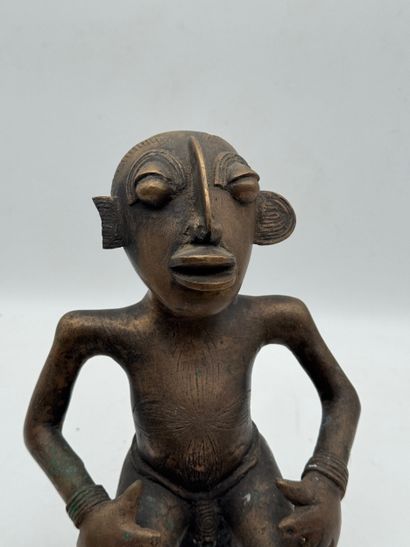 SEATED MALE STATUE WITH HANDS ON THIGHS
Mid-20th...
