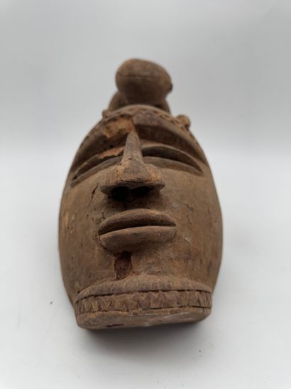 MASK WITH A FIGURE ON TOP
Mid-20th century....