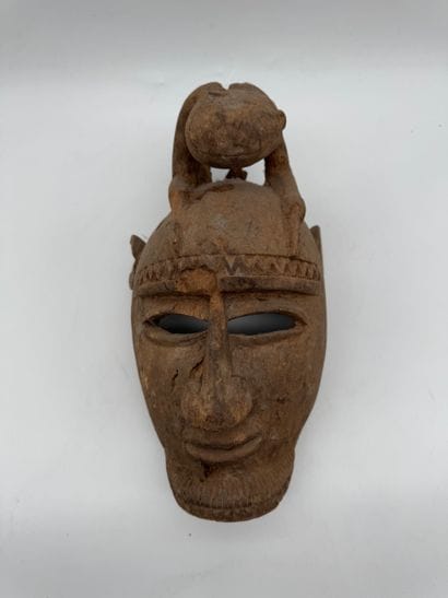 MASK WITH A FIGURE ON TOP
Mid-20th century....