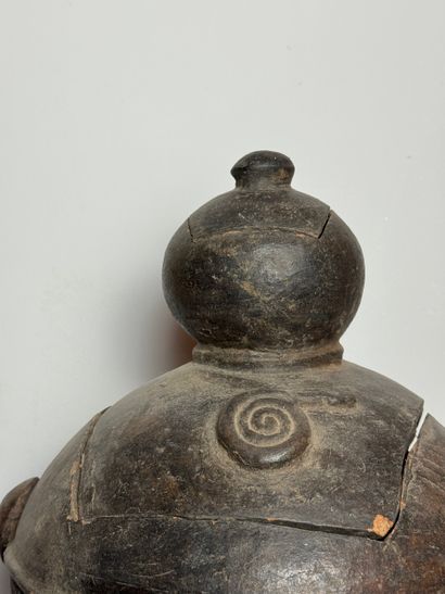 BILOBATE JAR WITH LID
Mid-20th century. Dark-colored...
