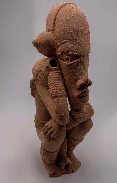KNELT FIGURE, IN THE STYLE OF THE NOK CULTURE...