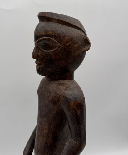 MALE STATUETTE
Mid-20th century. Wood with...