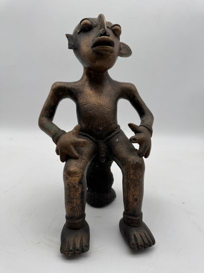 SEATED MALE STATUE WITH HANDS ON THIGHS
Mid-20th...
