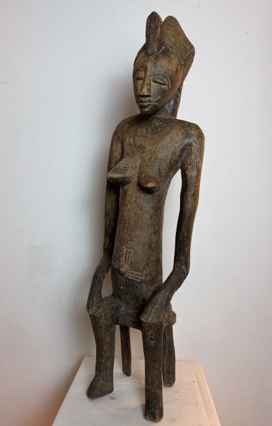 STATUE OF A SEATED WOMAN, SENOUFO, IVORY...