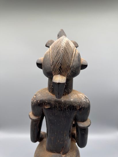 MOTHER WITH CHILD SEATED ON A STOOL, SENOUFO,...