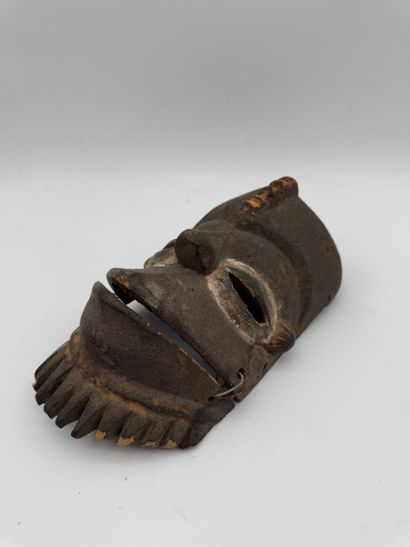MASK WITH MOVABLE JAW
Mid-20th century. Wood,...