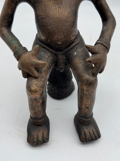 SEATED MALE STATUE WITH HANDS ON THIGHS
Mid-20th...