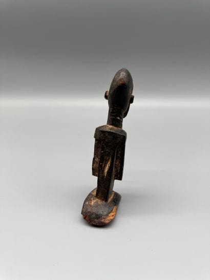 DOGON STATUETTE, MALI Wood with a dark patina....