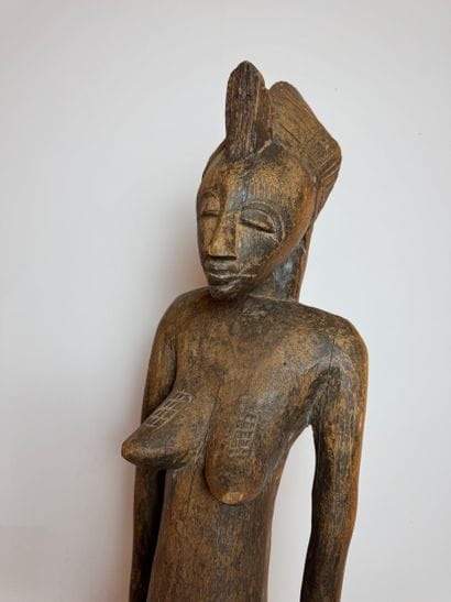 STATUE OF A SEATED WOMAN, SENOUFO, IVORY...