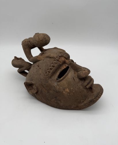 MASK WITH A FIGURE ON TOP
Mid-20th century....