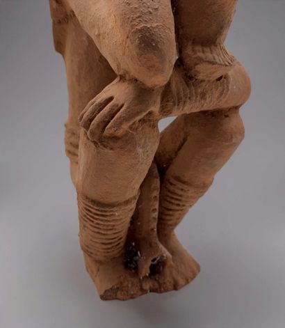 KNELT FIGURE, IN THE STYLE OF THE NOK CULTURE...