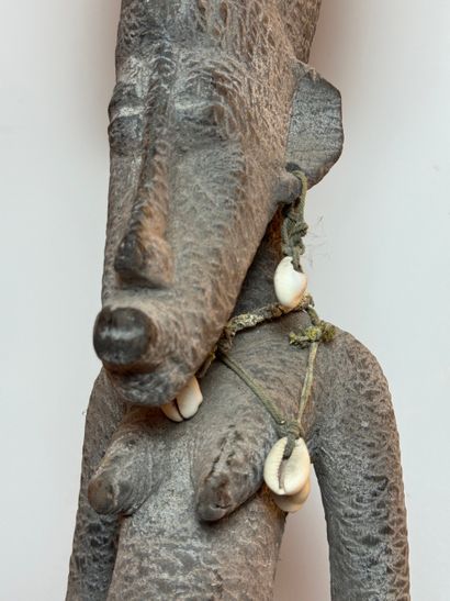 SEATED FEMALE FIGURE WEARING A BOWL ON HER...