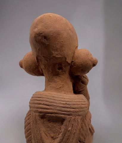KNELT FIGURE, IN THE STYLE OF THE NOK CULTURE...