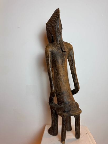 STATUE OF A SEATED WOMAN, SENOUFO, IVORY...