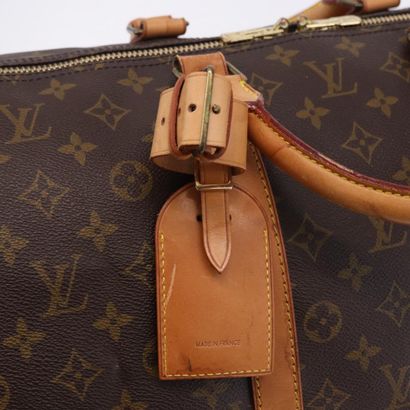 LOUIS VUITTON – Sac Keepall Bandoulière 55
Sac...