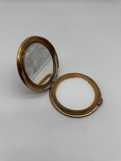 Small powder compact with a mirror, made...