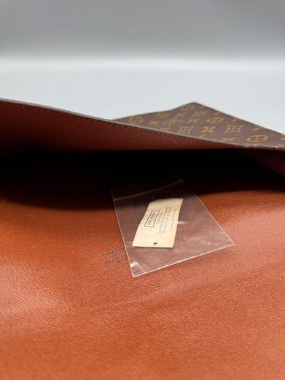 LOUIS VUITTON “SENATEUR” BRIEFCASE 
Monogram-coated...