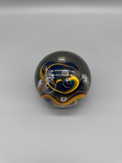 Glass paperweight with an interior design...