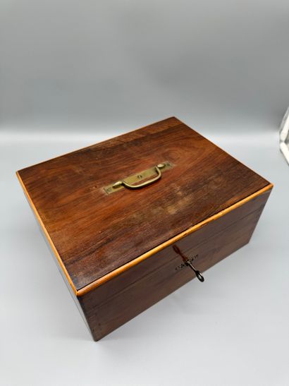 Wooden travel case with a hinged lid, featuring...