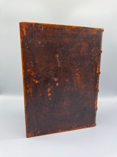 A trompe-l’œil box shaped like a book, covered...