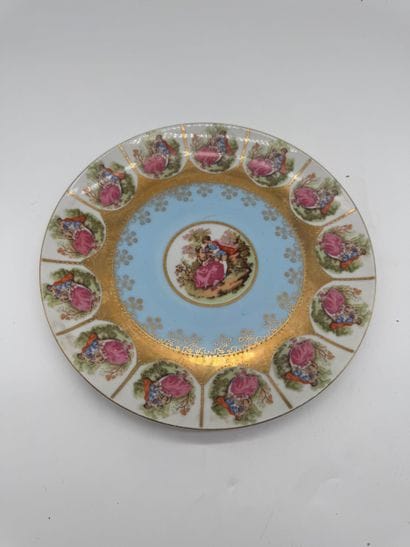 Decorative porcelain plate with a sky-blue...