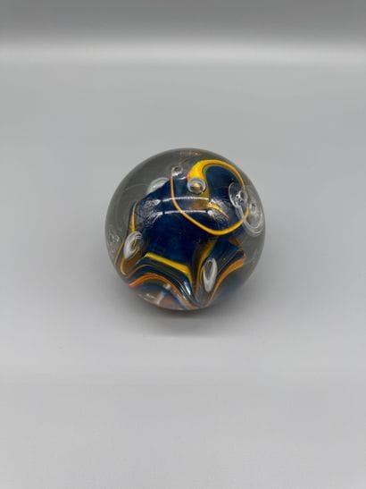Glass paperweight with an interior design...