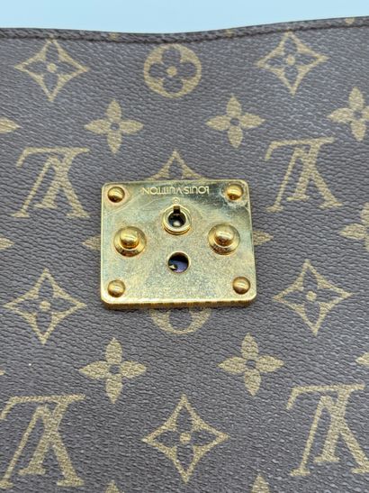 LOUIS VUITTON “SENATEUR” BRIEFCASE 
Monogram-coated...